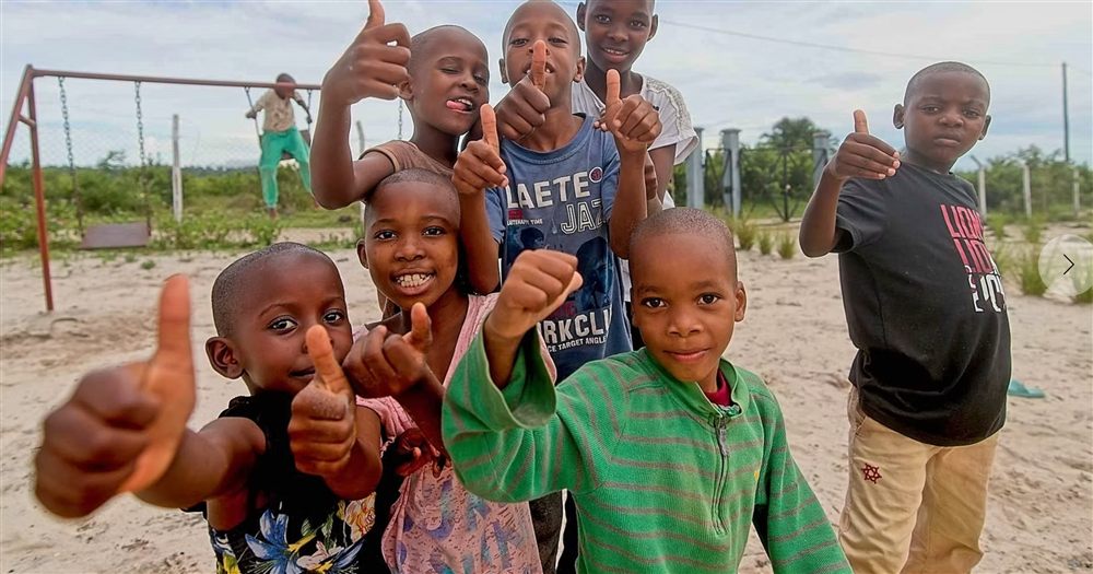 Children giving a thumbs up at a Gulf for Good funded project